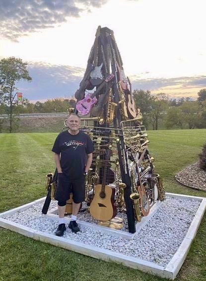 Creator, Bud Wilkinson pictured with Hungry for Music Guitar Tree.